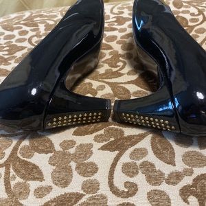 Stuart Weitzman black  Patten Leather heels with a little bling